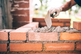 Industrial construction bricklayer worker