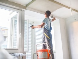 Plasterer renovating indoor walls and ceilings